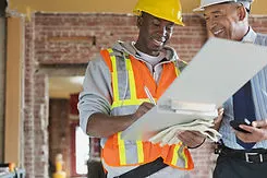 Tradesman and Architect at Construction 