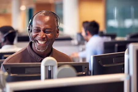mature-businessman-wearing-telephone-hea