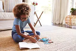 girl-sitting-on-the-floor-reading-instru